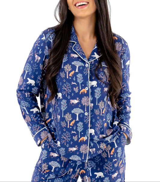 Woman wearing Women TENCEL Modal pajama set in Woodland Midnight print with long sleeves, showcasing comfort and sustainability.