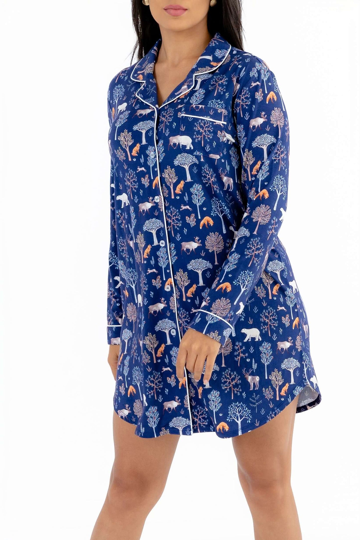 Women nightshirt long sleeve featuring a cozy blue design with forest animals and trees.