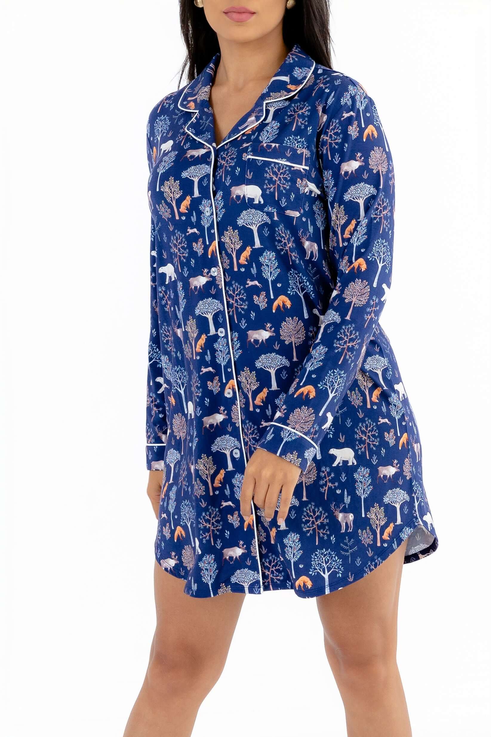Women nightshirt long sleeve featuring a cozy blue design with forest animals and trees.
