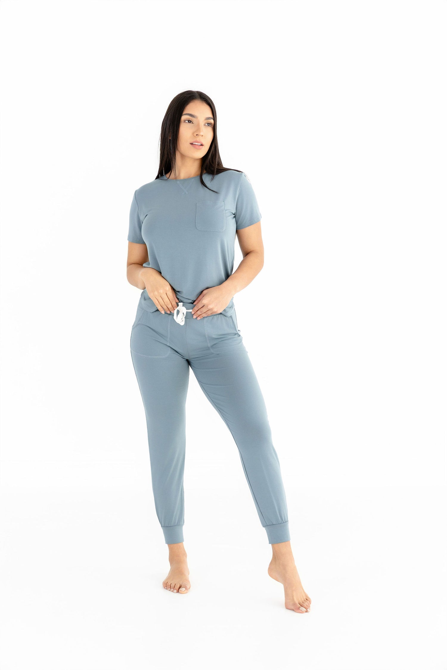 Woman wearing women modal pajama set in French blue with crew neck and joggers, perfect for lounging and comfortable sleep.